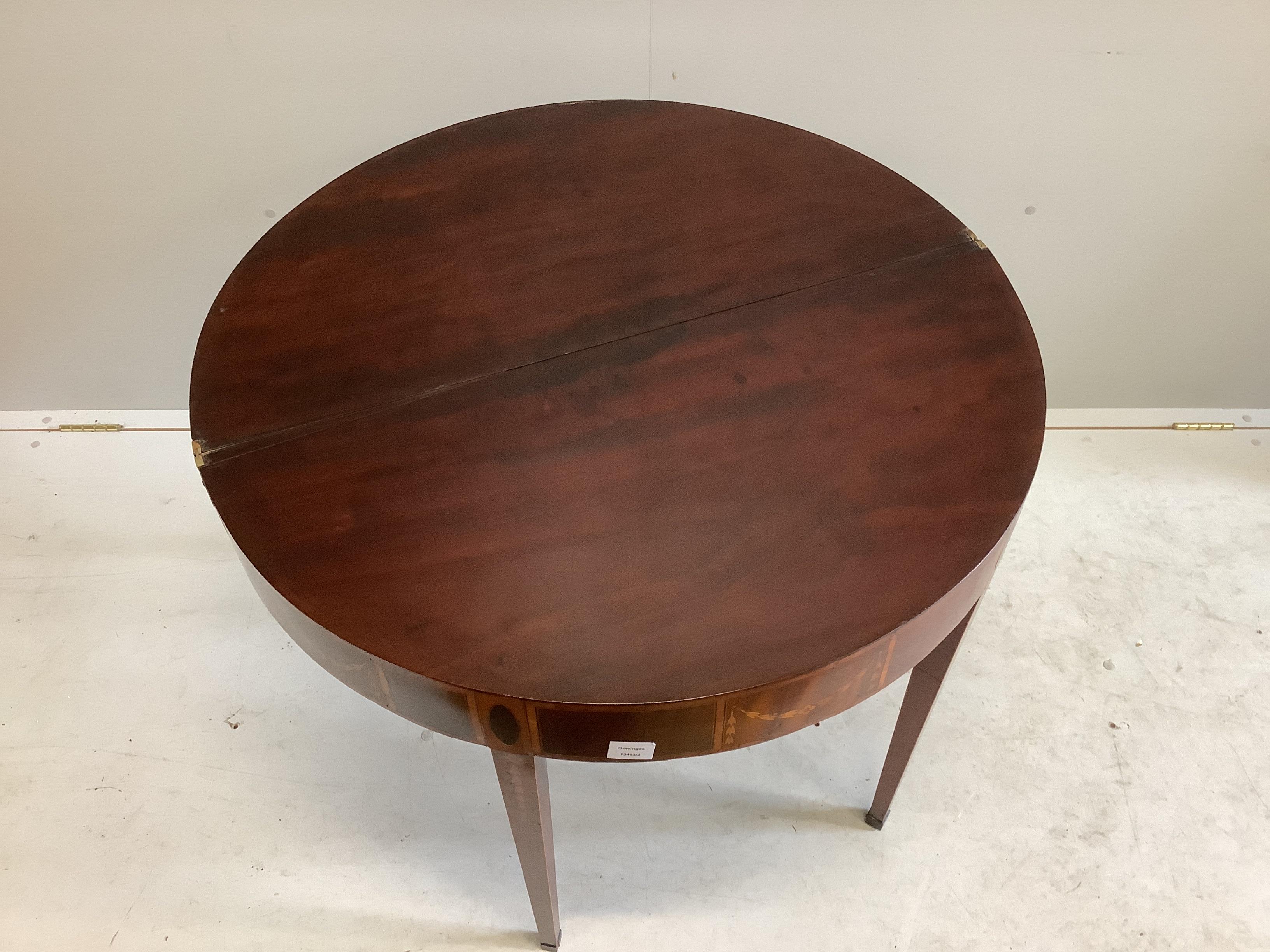 An Edwardian Sheraton Revival inlaid mahogany and marquetry D shaped card table, width 89cm, depth 44cm, height 75cm